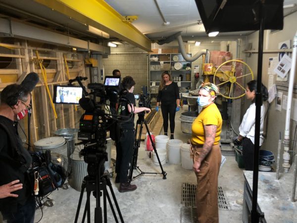 The film set in the Engineering Lab, with crew setting up.