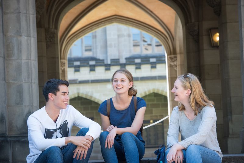 Students sitting on steps of Old Quad